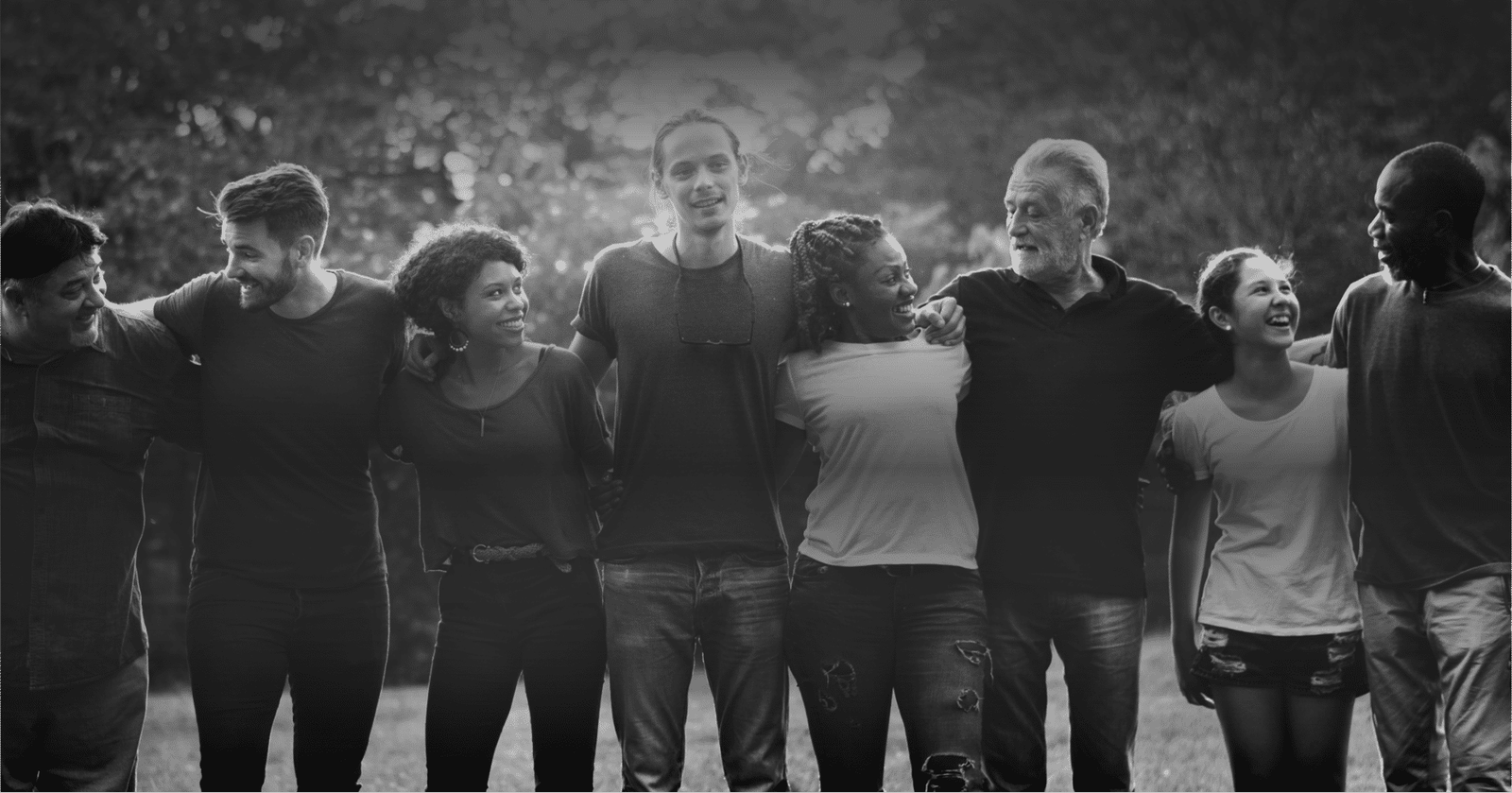A line of friends with their arms around each other